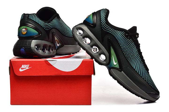 Black Nike sneakers with turquoise patterned uppers, gray midsoles, and a red shoe box