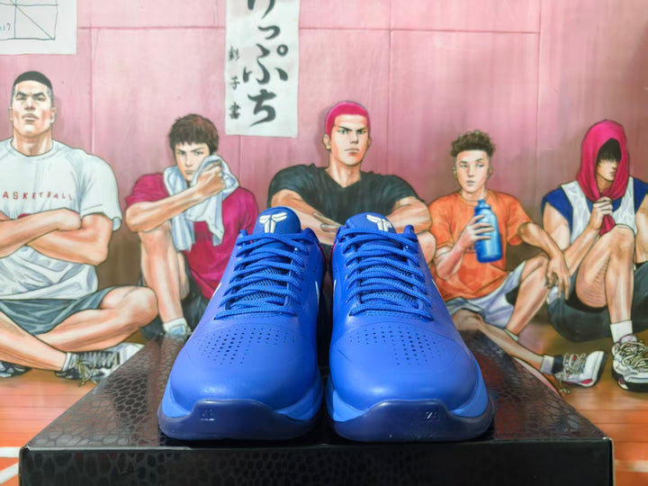 Front view of blue Nike basketball shoes with perforated toe panels and blue laces