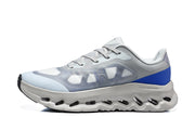Side profile highlighting the translucent panels, blue heel, and sculpted sole.