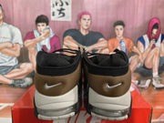 Rear view showing brown heel panels, black trim, Nike Swoosh logos, and contrasting light midsoles.