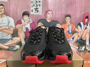 Front view showing the black toe boxes, laces, red toe accents, and visible Nike logos.