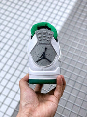 Rear view showing the gray heel panel, black Jumpman logo, white upper, and green outsole.