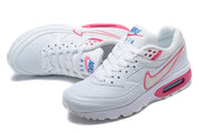 Pair of white Nike Air Max BW sneakers with pink Swoosh outlines and blue tongue branding.