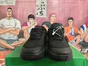 Front view of black Nike basketball shoes with lace-up closures
