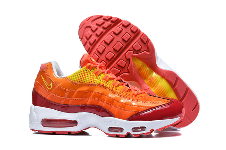 Nike Air Max 95 TT sneakers showing the red outsole and orange-red upper