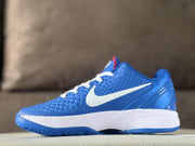 Opposite side view showing the textured blue upper, white Swoosh, padded collar, and layered heel structure.