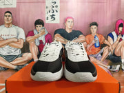 Front view of white and black Nike basketball shoes with white laces.