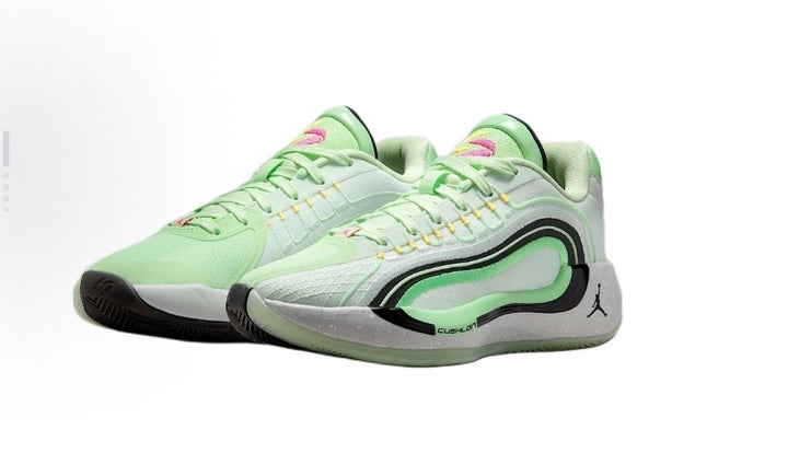 Pale green and white low-cut Jordan Luka 4 basketball shoes shown as a pair.