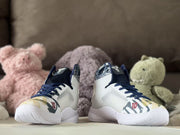 Front view of the pair, highlighting navy laces and patterned toes.