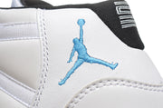 Close-up of the light blue Jordan logo embroidered on a white sneaker.