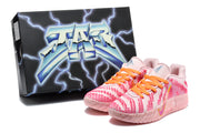 Pink Nike sneakers displayed beside a black star-themed box.