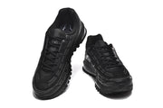 Top and front views of black Nike Air Max 97 OG sneakers