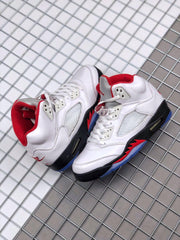 Pair of Air Jordan 5 sneakers displayed together, showing the white, black, red, and blue color blocking.