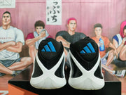 Rear view showing blue Adidas logos, black heel panels, and white soles.