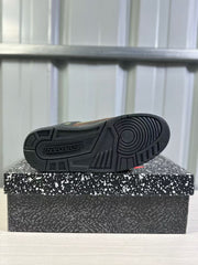 Bottom view showing the black rubber outsole with circular forefoot tread and geometric traction sections.