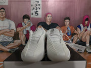 Front view of a pair of white Nike basketball sneakers showing the textured uppers and laces.