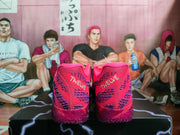 Rear view of the pink and purple Nike sneakers showing padded collars and contrasting heel details.