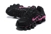 Pair of black and pink Nike Shox TL sneakers shown from above and at an angle