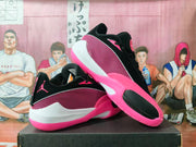 Angled view of the pair showing the black upper, pink mesh panels, white side sections, and pink soles.
