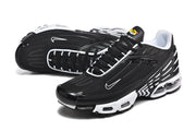 Angled view of black and white Nike Air Max Plus III sneakers
