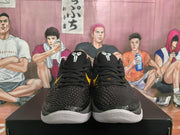 Front view of the pair showing black laces, textured toe boxes, white outsoles, and Kobe-style tongue logos.