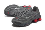 Pair of gray Nike Shox Ride 2 sneakers shown from angled front and side views.