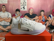 Side view of a white Nike Zoom 2K sneaker with a speckled panel and light lavender-toned midsole