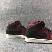 Rear three-quarter view of the pair showing black heel panels and burgundy collars.