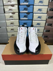 Top-front view of the pair showing white laces, metallic lace hardware, black toe sections and red tongue branding.
