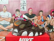 Side profile showing the brown high-top construction, patterned panels, pink accents, and segmented white-and-translucent sole.
