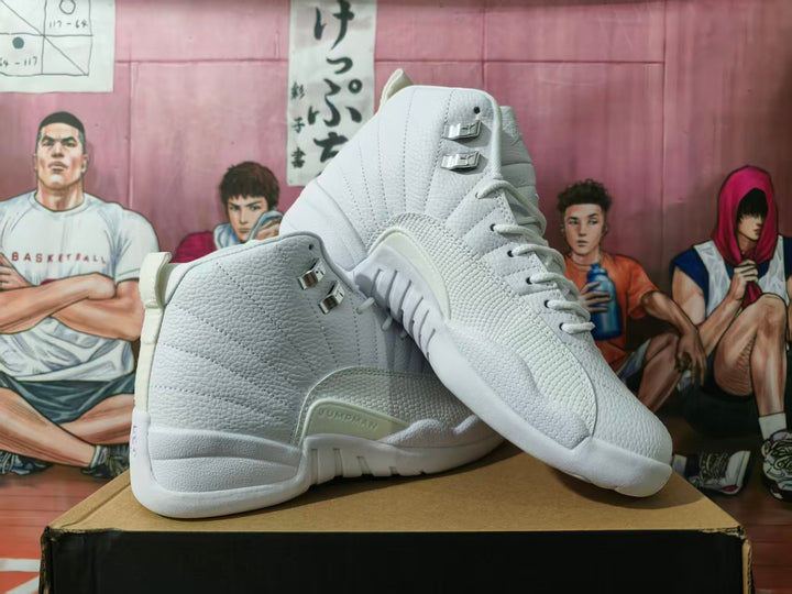 Pair of white high-top basketball sneakers showing textured uppers, metallic lace hardware, and a raised side detail.