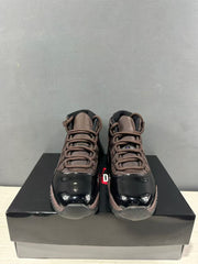 Front view of the pair showing bronze laces and glossy black toe sections.