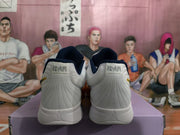 Rear view showing the white heels, navy collar lining, heel branding, and sculpted midsoles.