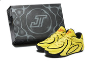 Yellow and black Jordan sneakers displayed beside a coordinating presentation box.