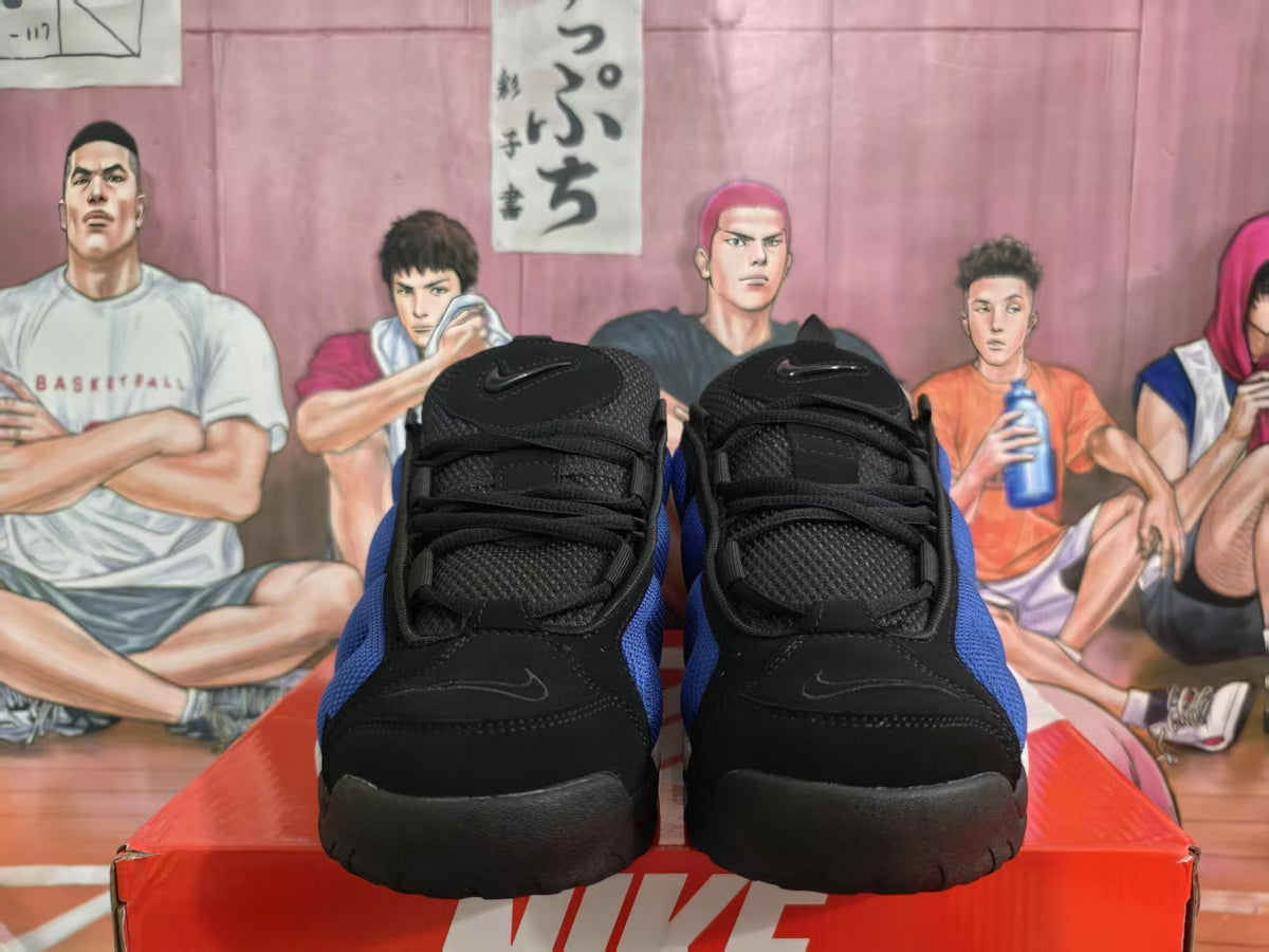 Front view of blue and black Nike basketball sneakers on a red Nike box