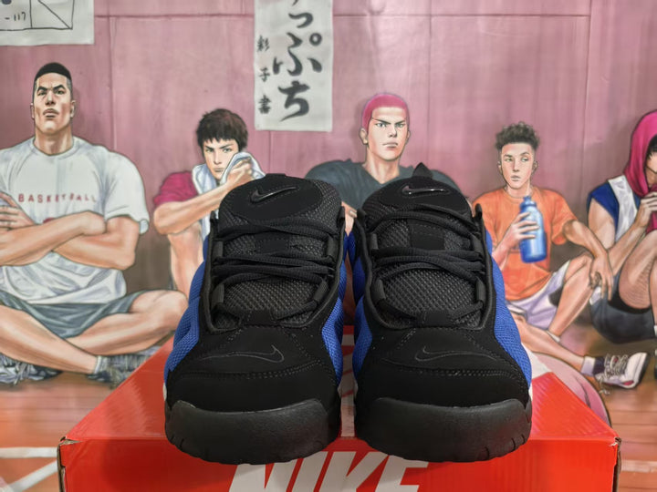 Front view of blue and black Nike basketball sneakers on a red Nike box
