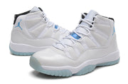 Angled pair view of white Jordan high-top sneakers with light blue outsole.