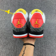 Rear view showing the red heel panels and yellow Jumpman details.