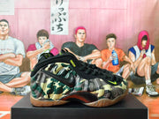 Side profile of camouflage Nike basketball shoes with black accents and gum-colored outsole.