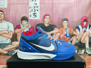 Side view highlighting the blue upper, white Nike Swoosh with red edging, patterned laces, and white midsole.