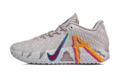 Side profile highlighting the teal and pink swoosh-style graphic and orange-pink heel detail