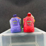 Rear view of the mismatched purple and red sneakers showing Teenage Mutant Ninja Turtles, M.E.L.O. and Puma graphics.