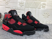 Pair of black and red Jordan 4 sneakers shown from the front three-quarter view.