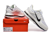 White Nike Pegasus Premium shoes displayed with an orange shoebox; the box label shows size 8 and 9.5.