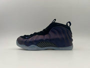 Black and deep purple high-top sneaker with a translucent outsole.