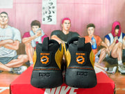 Rear view showing NDESTRUKT heel graphics and sculpted soles