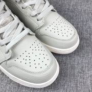 Close-up of the perforated toe box, laces, and layered stitching.