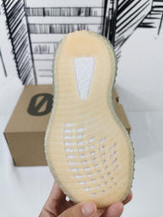 Bottom view showing the translucent outsole pattern and textured tread sections.