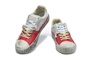 Pair of red and gray lace-up low-top sneakers viewed from the front
