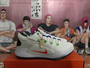 Side view showing a red Swoosh, colored lace accents, and speckled midsole